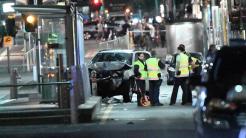 A damaged vehicle is seen at the scene of an incident on Flinders Street, in Melbourne, Thursday, December 21, 2017. Earlier a speeding car ploughed through pedestrians at Flinders Street in Melbourne's CBD in what police believe was a deliberate act . (AAP Image/James Ross) NO ARCHIVING
